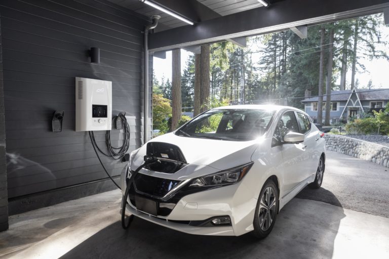 EV charged at garage symbolizing the electric vehicles tax credit